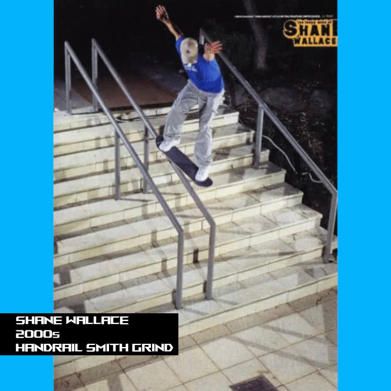 Shane grinding down a nine stair handrail at night. Shane is wearing a baseball hat.