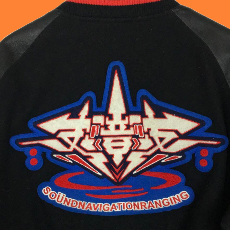 Close up image of the back detail of Japanese Street Fashion Jacket with Futuristic Graphic Style.