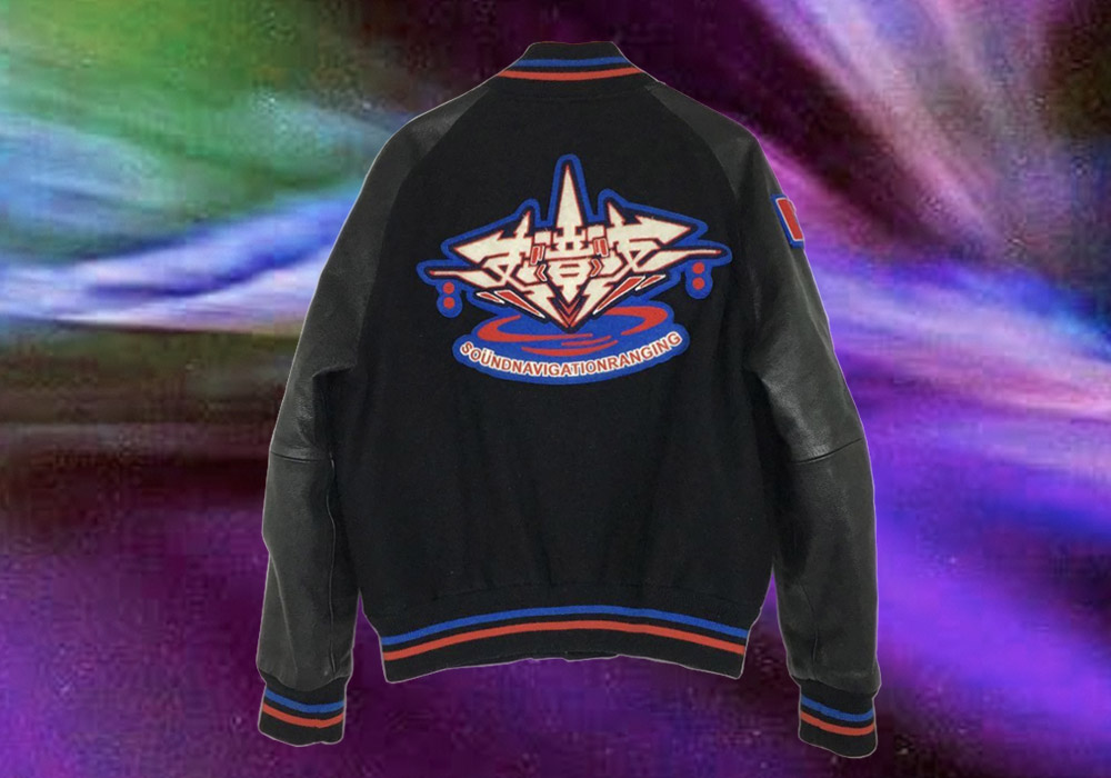 Jacket by Sonar Project with Futuristic Graffiti Style Graphic detailing on the back of the jacket.
    The background is a blur of energy and colors. 